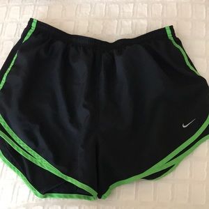Black with green dri fit Nike running shorts